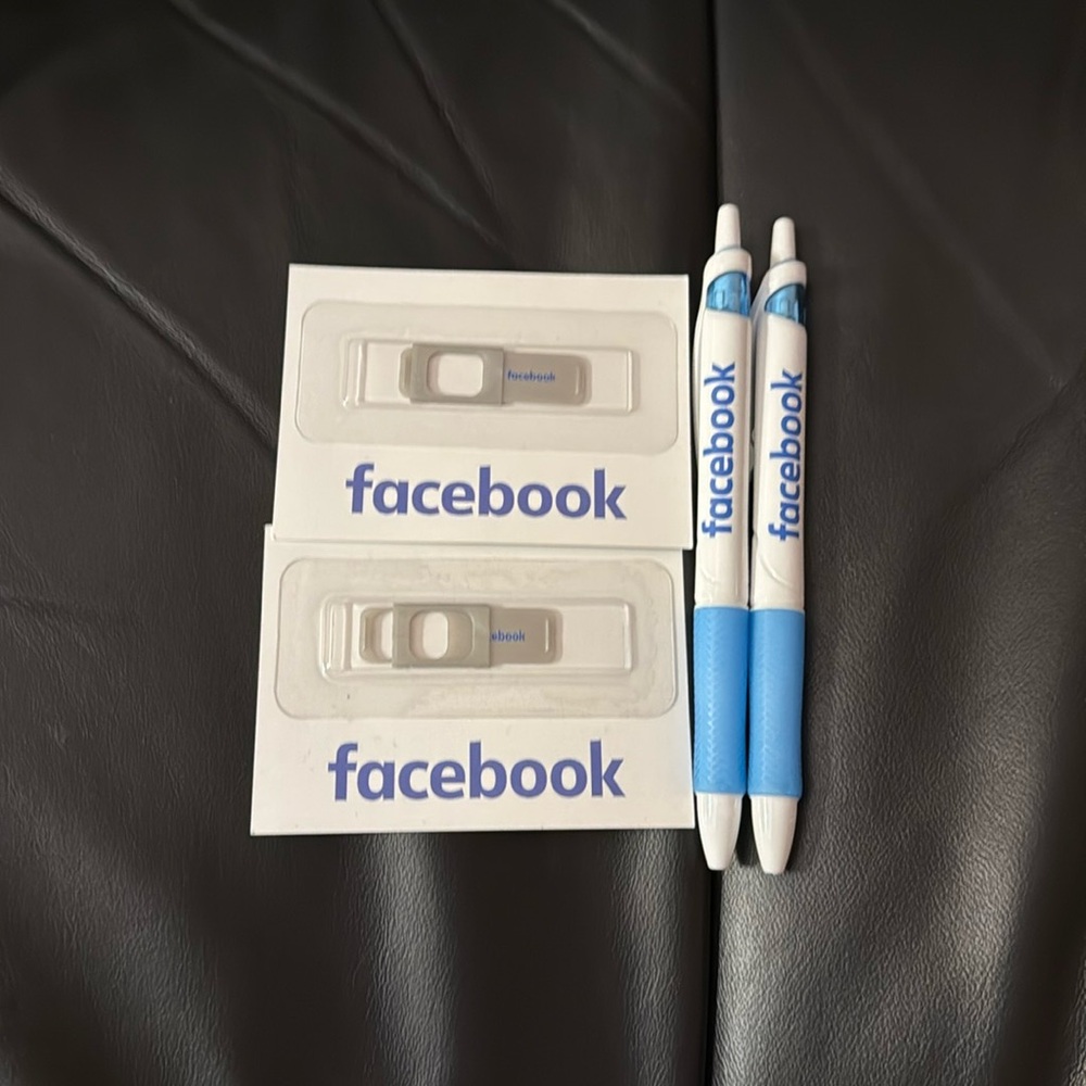 Facebook pens and laptop camera cover slides